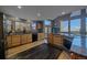 Large kitchen with stainless steel appliances and hardwood floors at 11222 Conifer Mountain Rd, Conifer, CO 80433