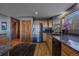 Kitchen features granite countertops, stainless appliances and wooden cabinets at 11222 Conifer Mountain Rd, Conifer, CO 80433