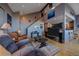 Comfortable living room featuring vaulted ceilings, wood floors, and an open concept design at 11222 Conifer Mountain Rd, Conifer, CO 80433