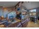 Open concept living room with hardwood floors, and a shark painting at 11222 Conifer Mountain Rd, Conifer, CO 80433