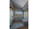 Stunning shower with bench seating and a window to outdoor scenery at 11222 Conifer Mountain Rd, Conifer, CO 80433