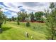 Expansive backyard offers plenty of space for outdoor activities, surrounded by mature trees and landscaping at 5185 E Weaver Dr, Centennial, CO 80121