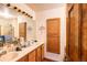 Bathroom features a double sink vanity, providing convenience and ample space at 5185 E Weaver Dr, Centennial, CO 80121