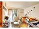 Cozy Bedroom, decorated with cheerful artwork and a comfortable rocking chair at 5185 E Weaver Dr, Centennial, CO 80121