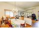 Dining room with chandelier lighting, a large window, and hardwood floors at 5185 E Weaver Dr, Centennial, CO 80121