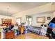 Cozy living area with hardwood floors, bright windows, and ample natural light at 5185 E Weaver Dr, Centennial, CO 80121