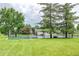 Well-maintained community tennis courts surrounded by lush trees and green space, promoting an active lifestyle at 5185 E Weaver Dr, Centennial, CO 80121