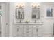 Bright bathroom featuring dual sinks, granite counters, and modern fixtures at 5428 Golden Currant Way, Parker, CO 80134