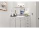 Bright bathroom with marble countertop, ample storage, and modern fixtures at 5428 Golden Currant Way, Parker, CO 80134