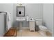 Neat bathroom with pedestal sink, tiled floor, and well-maintained fixtures at 5428 Golden Currant Way, Parker, CO 80134