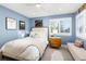 Charming bedroom featuring a comfy bed, stylish decor, and an abundance of natural light at 5428 Golden Currant Way, Parker, CO 80134