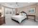 Cozy bedroom with large windows, ceiling fan, and a neutral color palette at 5428 Golden Currant Way, Parker, CO 80134