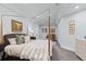 Serene bedroom showcasing a four-poster bed, soft lighting, and tranquil ambiance at 5428 Golden Currant Way, Parker, CO 80134