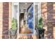 Inviting entrance featuring a bright blue door, tiled staircase, and interior view at 5428 Golden Currant Way, Parker, CO 80134