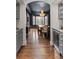 View of dining room from hallway featuring butler's pantry with wine cooler at 5428 Golden Currant Way, Parker, CO 80134