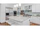 Modern kitchen features stainless steel appliances, granite counters and eat in island at 5428 Golden Currant Way, Parker, CO 80134