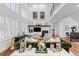 Sophisticated living area boasting abundant light, tall ceilings, and contemporary furnishings at 5428 Golden Currant Way, Parker, CO 80134