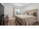 Cozy bedroom with a large comfortable bed and neutral color palette at 18012 E 107Th Ave, Commerce City, CO 80022