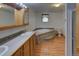 Bathroom with vanity, dual sinks, soaking tub and a separate shower at 233 Cherokee Ct, Brighton, CO 80603