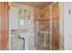 Elegant bathroom featuring a pedestal sink and glass-enclosed shower at 945 Niagara St, Denver, CO 80220