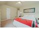 Bright bedroom featuring neutral walls, carpet, and decor, with a large, comfortable bed at 945 Niagara St, Denver, CO 80220