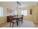 Formal dining room with a wooden table set on a patterned rug, lit by a modern pendant light fixture at 945 Niagara St, Denver, CO 80220