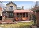 Charming backyard patio featuring an awning and outdoor seating at 945 Niagara St, Denver, CO 80220