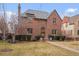 Charming brick two-story home with manicured lawn, slate roof and welcoming front entry at 945 Niagara St, Denver, CO 80220