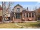 Charming backyard featuring a patio, outdoor seating, and manicured lawn at 945 Niagara St, Denver, CO 80220