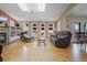 Living room with skylights, fireplace, and a large window offers an inviting and light-filled atmosphere at 945 Niagara St, Denver, CO 80220