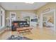 Spacious living room featuring hardwood floors, a wet bar, and lots of natural light at 945 Niagara St, Denver, CO 80220