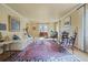 Inviting living room with fireplace, hardwood floors, plush seating and natural light at 945 Niagara St, Denver, CO 80220