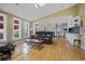 Spacious living room featuring hardwood floors, a wet bar, and lots of natural light at 945 Niagara St, Denver, CO 80220