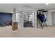 Finished basement with exercise area, including a whiteboard and various games and toys at 14075 Willow Wood Ct, Broomfield, CO 80020