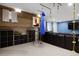 Finished basement area with climbing rope, slide, sofa, and entertainment center at 14075 Willow Wood Ct, Broomfield, CO 80020