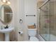 Cozy bathroom with walk-in shower, updated vanity and toilet at 14075 Willow Wood Ct, Broomfield, CO 80020