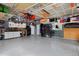 Spacious garage with epoxy flooring, storage solutions, and ample workspace at 14075 Willow Wood Ct, Broomfield, CO 80020