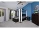 Serene main bedroom with canopy bed, bright windows, and stylish decor at 14075 Willow Wood Ct, Broomfield, CO 80020