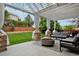 Beautiful outdoor patio with pergola, contemporary furniture, and fire pit at 14075 Willow Wood Ct, Broomfield, CO 80020