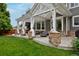 Charming outdoor patio with pergola, stone columns, fire pit and backyard view at 14075 Willow Wood Ct, Broomfield, CO 80020