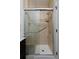 Tiled shower with glass door and bench provides a spa-like experience at 14075 Willow Wood Ct, Broomfield, CO 80020