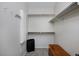 Walk-in closet with ample shelving and storage space for clothes and accessories at 14075 Willow Wood Ct, Broomfield, CO 80020