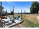 Landscaped backyard with patio, fire pit, and well-maintained lawn at 129 N Irvington St, Aurora, CO 80018