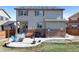 This backyard has a lovely concrete patio with chairs and a natural gas fire pit, great for entertaining at 129 N Irvington St, Aurora, CO 80018
