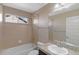 Bathroom with bathtub, granite countertop vanity, and a shower head at 129 N Irvington St, Aurora, CO 80018