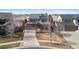 View of a well-maintained two-story home with brick and siding, plus a two car garage at 129 N Irvington St, Aurora, CO 80018