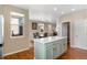 Stylish kitchen island with barstool seating and open layout to dining area at 129 N Irvington St, Aurora, CO 80018