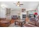 Inviting living room featuring a fireplace, hardwood floors, and ample natural light at 129 N Irvington St, Aurora, CO 80018