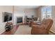 Cozy living room with a fireplace, comfortable chairs, and a television at 129 N Irvington St, Aurora, CO 80018