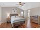 Main bedroom suite with hardwood floors and an ensuite bathroom at 129 N Irvington St, Aurora, CO 80018